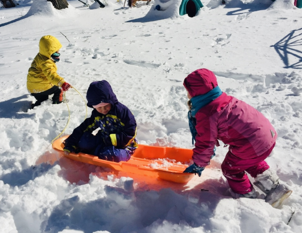 Kids playing in the snow.